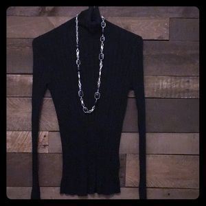 Black ribbed turtle neck sweater.
